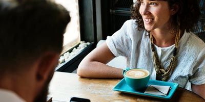 Tax Attorney consulting with client over coffee