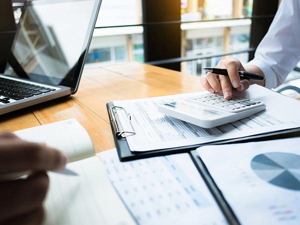 The desk of a Tax Attorney working on the tax return of a client