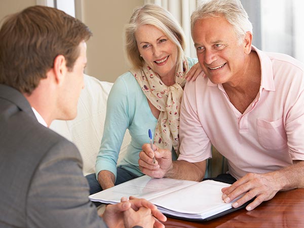 A couple works with an Estate Planning Attorney